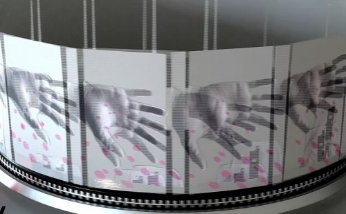 Four pictures of a sideways palm on a circular turntable as part of a zoetrope.